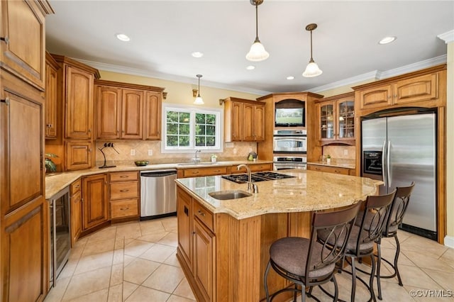 3631 Cannon Ridge Ct, Midlothian, VA 23113 - kitchen featuring appliances with stainless steel finishes, brown cabinetry, light tile patterned floors, an island with sink, and backsplash
