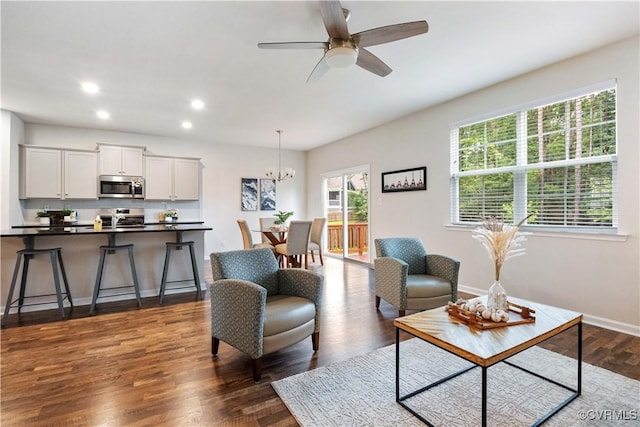 15037 Hazelbury Cir, Midlothian, VA 23112 - living room with a chandelier, dark wood-style flooring, a ceiling fan, and recessed lighting