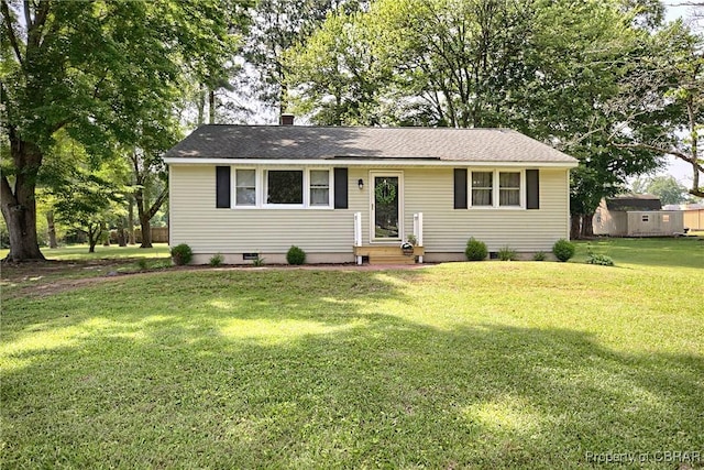 7284 Farinholt St, Gloucester, VA 23061 - view of front of home with a front yard, a chimney, and roof with shingles