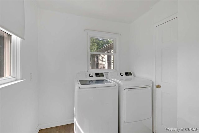 7284 Farinholt St, Gloucester, VA 23061 - washroom featuring washing machine and clothes dryer and wood finished floors
