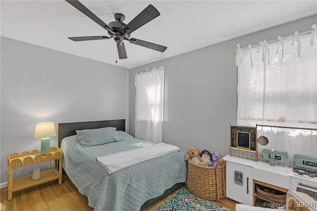 7284 Farinholt St, Gloucester, VA 23061 - bedroom with light wood finished floors and a ceiling fan