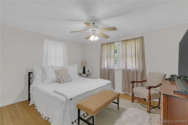 7284 Farinholt St, Gloucester, VA 23061 - bedroom with light wood finished floors and a ceiling fan