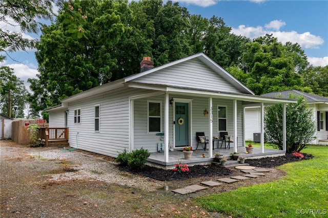 3315 Romancoke Ave, West Point, VA 23181 - view of front of house featuring covered porch and a chimney
