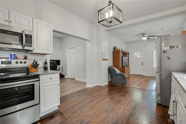 3315 Romancoke Ave, West Point, VA 23181 - kitchen with appliances with stainless steel finishes, dark wood-type flooring, and white cabinetry