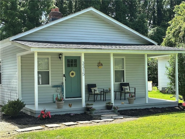 3315 Romancoke Ave, West Point, VA 23181 - bungalow-style house with covered porch, roof with shingles, and a chimney