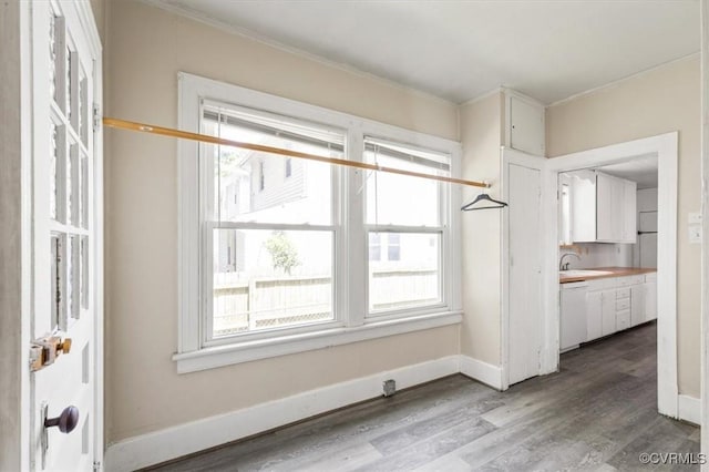 224 Hamilton Ave, Colonial Heights, VA 23834 - unfurnished dining area featuring healthy amount of natural light, wood finished floors, and ornamental molding