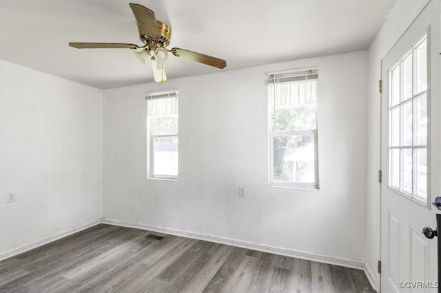 224 Hamilton Ave, Colonial Heights, VA 23834 - empty room with healthy amount of natural light, a ceiling fan, and wood finished floors