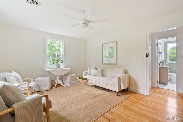 8467 Shady Grove Rd, Mechanicsville, VA 23116 - living room with healthy amount of natural light, light wood-style floors, and ceiling fan