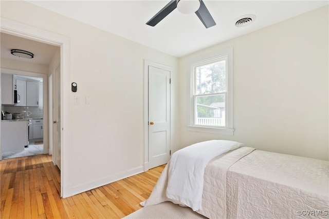 8467 Shady Grove Rd, Mechanicsville, VA 23116 - bedroom with light wood finished floors and a ceiling fan