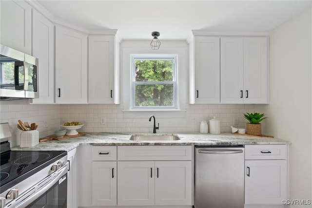 8467 Shady Grove Rd, Mechanicsville, VA 23116 - kitchen featuring stainless steel appliances, tasteful backsplash, white cabinets, and light stone counters
