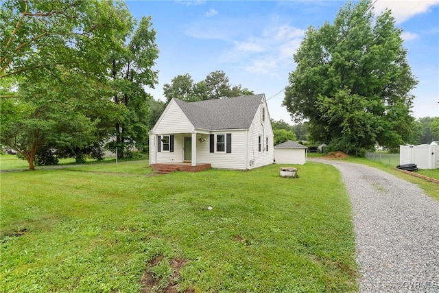 8467 Shady Grove Rd, Mechanicsville, VA 23116 - view of front facade with gravel driveway, a porch, and a shingled roof
