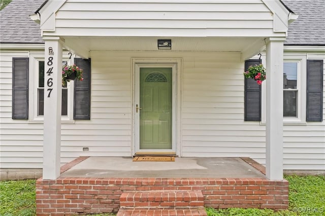 8467 Shady Grove Rd, Mechanicsville, VA 23116 - entrance to property with a shingled roof and covered porch