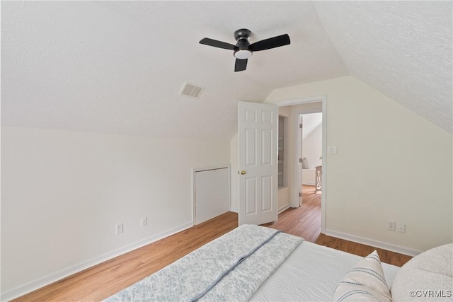 8467 Shady Grove Rd, Mechanicsville, VA 23116 - bedroom featuring wood finished floors, lofted ceiling, ceiling fan, and a textured ceiling
