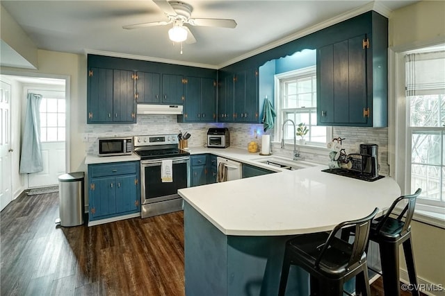 813 Spirea Rd, North Chesterfield, VA 23236 - kitchen with stainless steel appliances, under cabinet range hood, and plenty of natural light