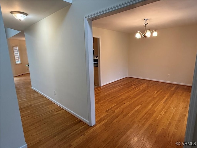 14005 Cooperton Cir, Chester, VA 23836 - spare room with wood finished floors and a chandelier