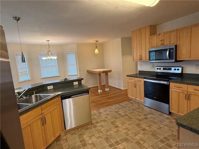 14005 Cooperton Cir, Chester, VA 23836 - kitchen featuring stainless steel appliances, dark countertops, hanging light fixtures, light brown cabinets, and a chandelier