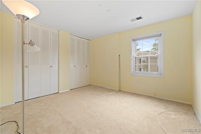 21 Rock Garden Ln, Henrico, VA 23228 - unfurnished bedroom with two closets and carpet flooring