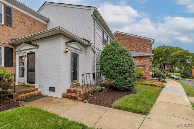 21 Rock Garden Ln, Henrico, VA 23228 - view of home's exterior featuring brick siding and crawl space