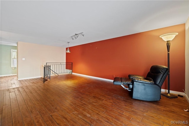 21 Rock Garden Ln, Henrico, VA 23228 - unfurnished room featuring an upstairs landing, wood finished floors, and track lighting
