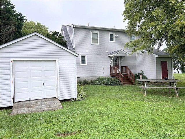 4030 Wellfords Wharf Rd, Warsaw, VA 22572 - rear view of property featuring an outdoor structure and a lawn