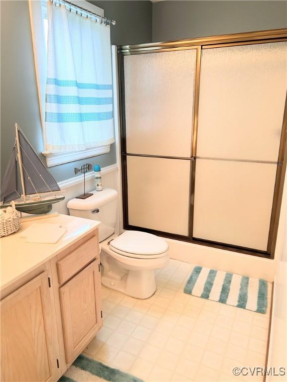 4030 Wellfords Wharf Rd, Warsaw, VA 22572 - full bathroom featuring vanity, a shower with shower door, and tile patterned floors