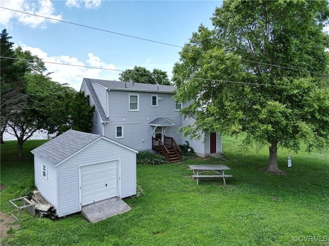 4030 Wellfords Wharf Rd, Warsaw, VA 22572 - back of house featuring an outbuilding, a lawn, and roof with shingles