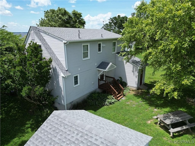 4030 Wellfords Wharf Rd, Warsaw, VA 22572 - back of property featuring a lawn and roof with shingles
