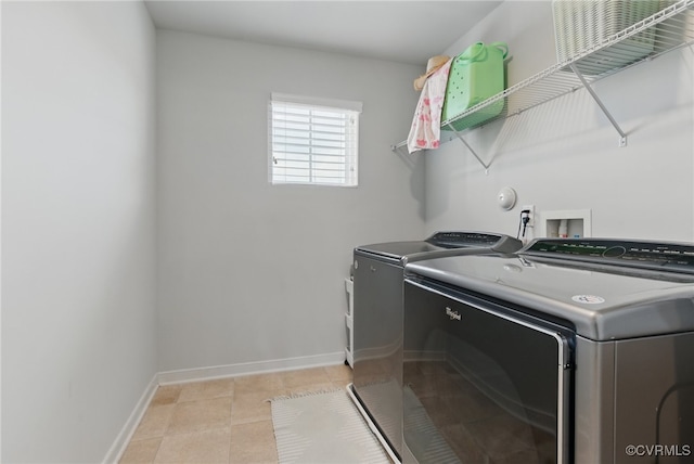 6906 Stafford Park Dr, Moseley, VA 23120 - laundry area with washing machine and dryer and light tile patterned floors