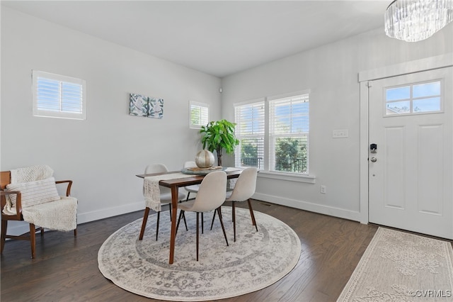 6906 Stafford Park Dr, Moseley, VA 23120 - dining space with dark wood-type flooring and a chandelier