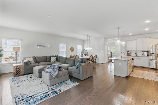 6906 Stafford Park Dr, Moseley, VA 23120 - living room with healthy amount of natural light, wood finished floors, recessed lighting, and a chandelier