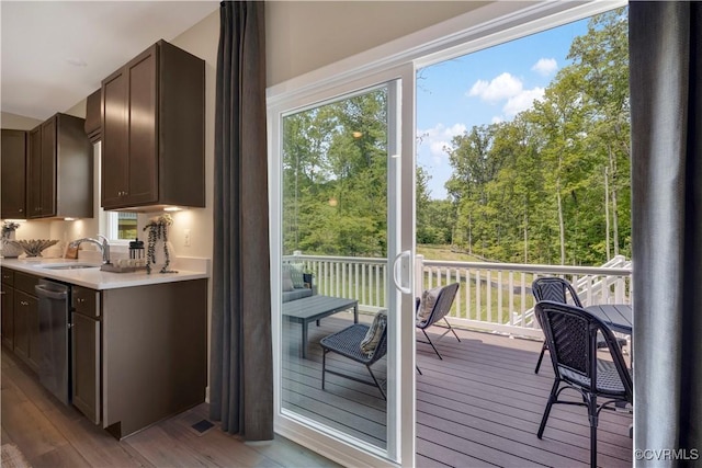 15707 Greenhart Dr, Chesterfield, VA 23832 - kitchen featuring light countertops, stainless steel dishwasher, light wood finished floors, and dark brown cabinets