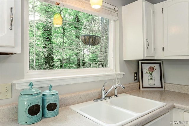 3111 Three Bridges Rd, Midlothian, VA 23112 - kitchen with white cabinets, plenty of natural light, and light countertops