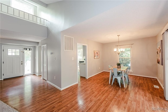 3111 Three Bridges Rd, Midlothian, VA 23112 - dining space featuring a chandelier and light wood-type flooring