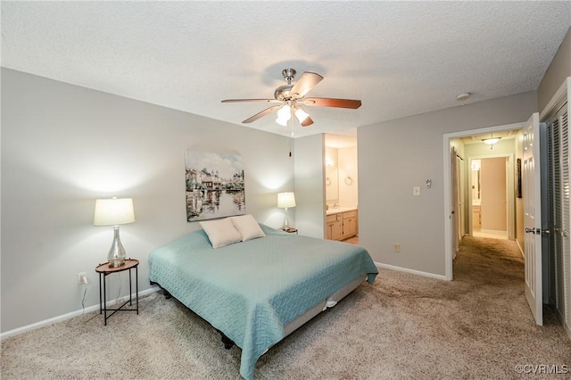 3111 Three Bridges Rd, Midlothian, VA 23112 - bedroom with light carpet, a textured ceiling, connected bathroom, and ceiling fan
