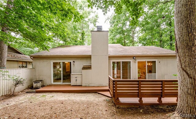 3111 Three Bridges Rd, Midlothian, VA 23112 - rear view of property featuring a deck, a chimney, and a shingled roof