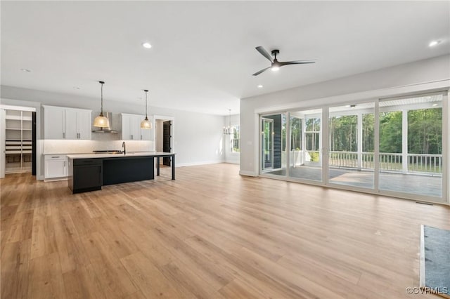5-6 Pocahontas Trl, Providence Forge, VA 23089 - unfurnished living room featuring a ceiling fan, light wood-style floors, and recessed lighting