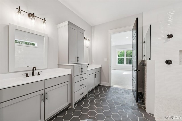 5-6 Pocahontas Trl, Providence Forge, VA 23089 - full bath with a walk in shower, two vanities, and tile patterned floors