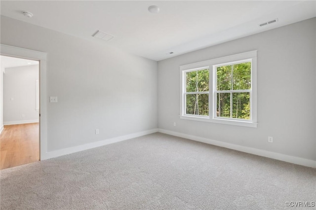 5-6 Pocahontas Trl, Providence Forge, VA 23089 - spare room featuring light carpet and a smoke detector