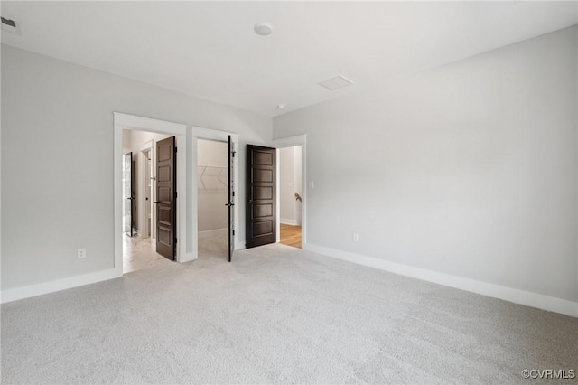5-6 Pocahontas Trl, Providence Forge, VA 23089 - unfurnished bedroom with carpet, a spacious closet, and a closet