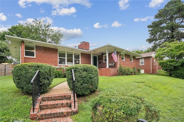 610 N 39th St, Richmond, VA 23223 - ranch-style home with brick siding, a chimney, and ceiling fan