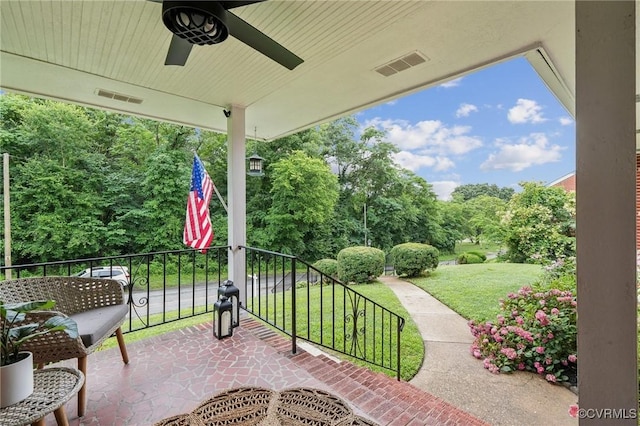 610 N 39th St, Richmond, VA 23223 - patio / terrace featuring ceiling fan, a lawn, and view of wooded area