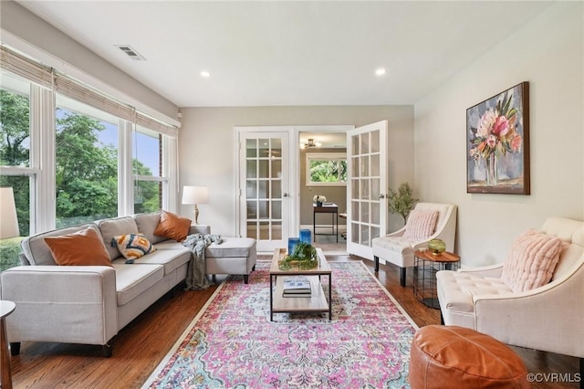 610 N 39th St, Richmond, VA 23223 - living room featuring wood finished floors, french doors, and recessed lighting