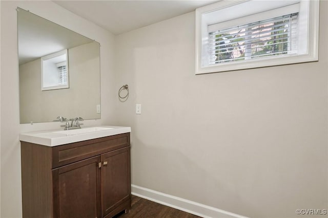 610 N 39th St, Richmond, VA 23223 - bathroom featuring vanity and wood finished floors