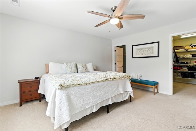 2201 Vandover Rd, Henrico, VA 23229 - bedroom featuring light carpet, a walk in closet, a closet, and ceiling fan