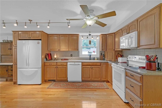 6661 Powhatan Dr, Hayes, VA 23072 - kitchen with white appliances, ceiling fan, light wood finished floors, and decorative backsplash