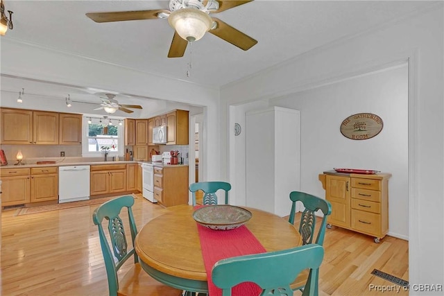 6661 Powhatan Dr, Hayes, VA 23072 - dining area with light wood-style flooring and a ceiling fan