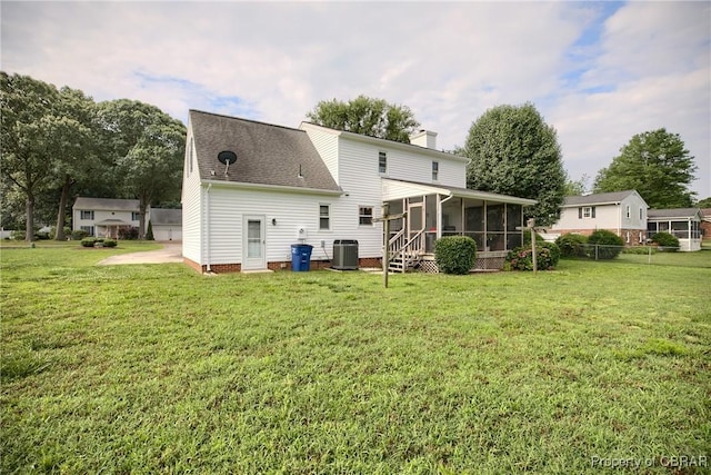 6661 Powhatan Dr, Hayes, VA 23072 - rear view of property with a sunroom, a chimney, and a shingled roof