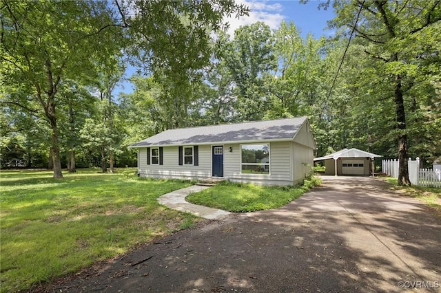 8238 Lansdowne Rd, Mechanicsville, VA 23116 - ranch-style house featuring asphalt driveway, an outbuilding, and a garage