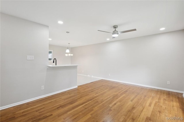 8238 Lansdowne Rd, Mechanicsville, VA 23116 - unfurnished room with a chandelier, recessed lighting, light wood-style floors, and a ceiling fan