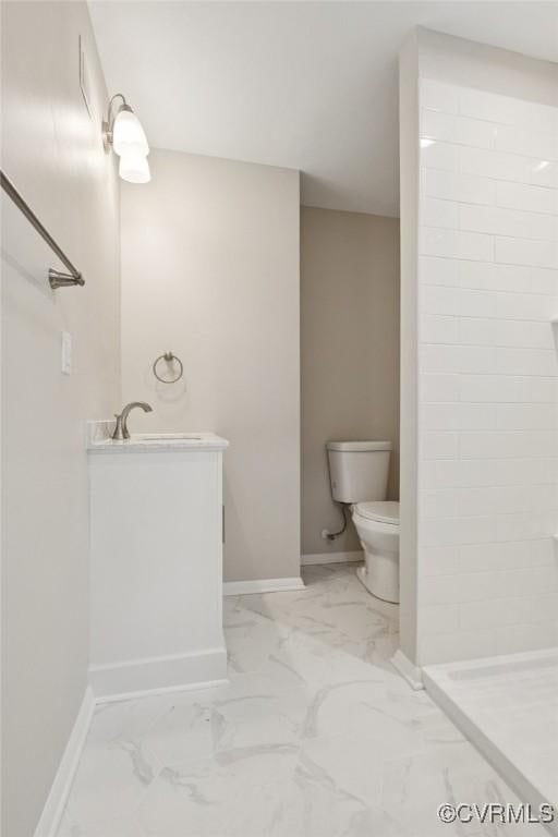 8238 Lansdowne Rd, Mechanicsville, VA 23116 - full bath with tiled shower, marble look tiles, and vanity